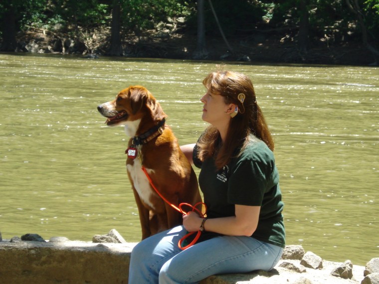 Denise and Chloe sit next to the Potomac at Harper's Ferry, WV